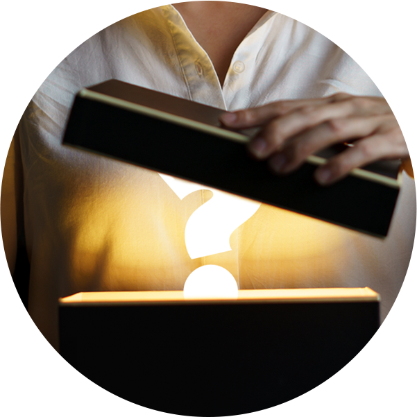 graphic of a person opening a black box with a white "?" mark inside