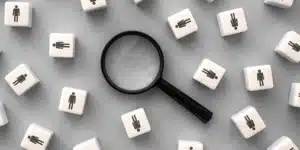 magnifying glass and people on chips graphic