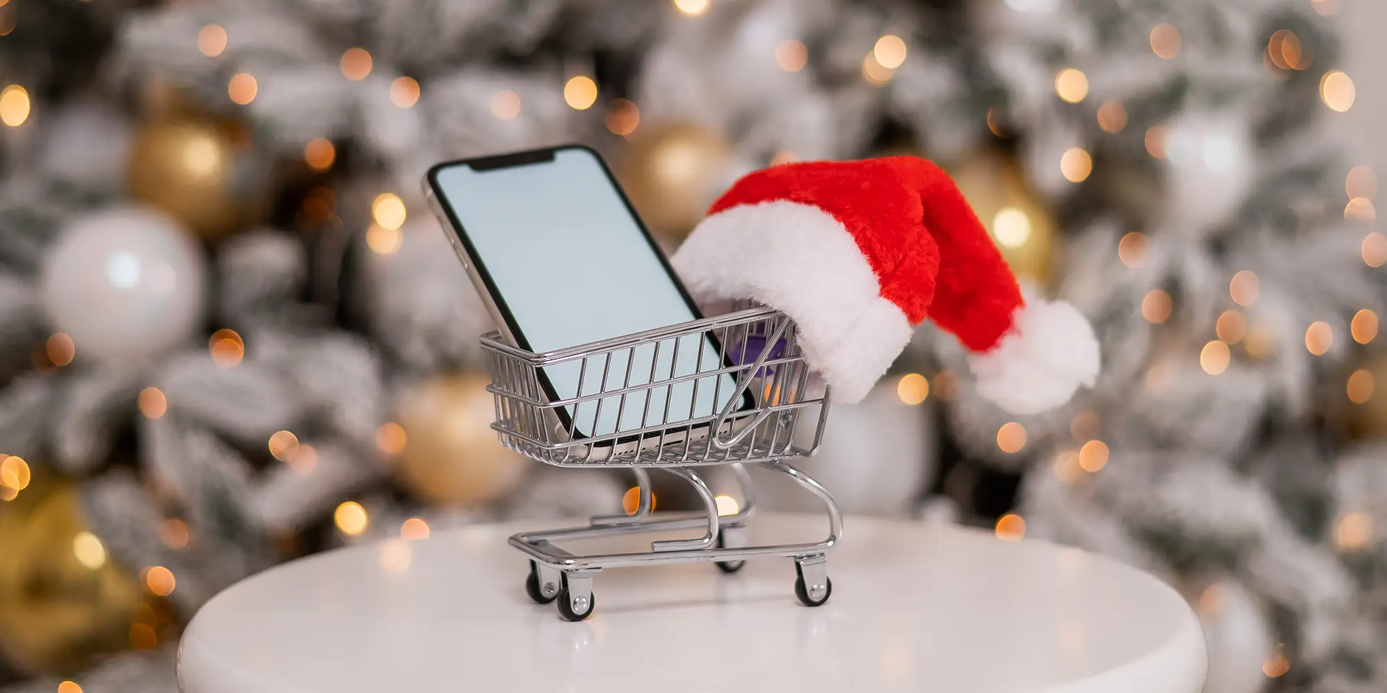 mobile phone in a mini shopping cart