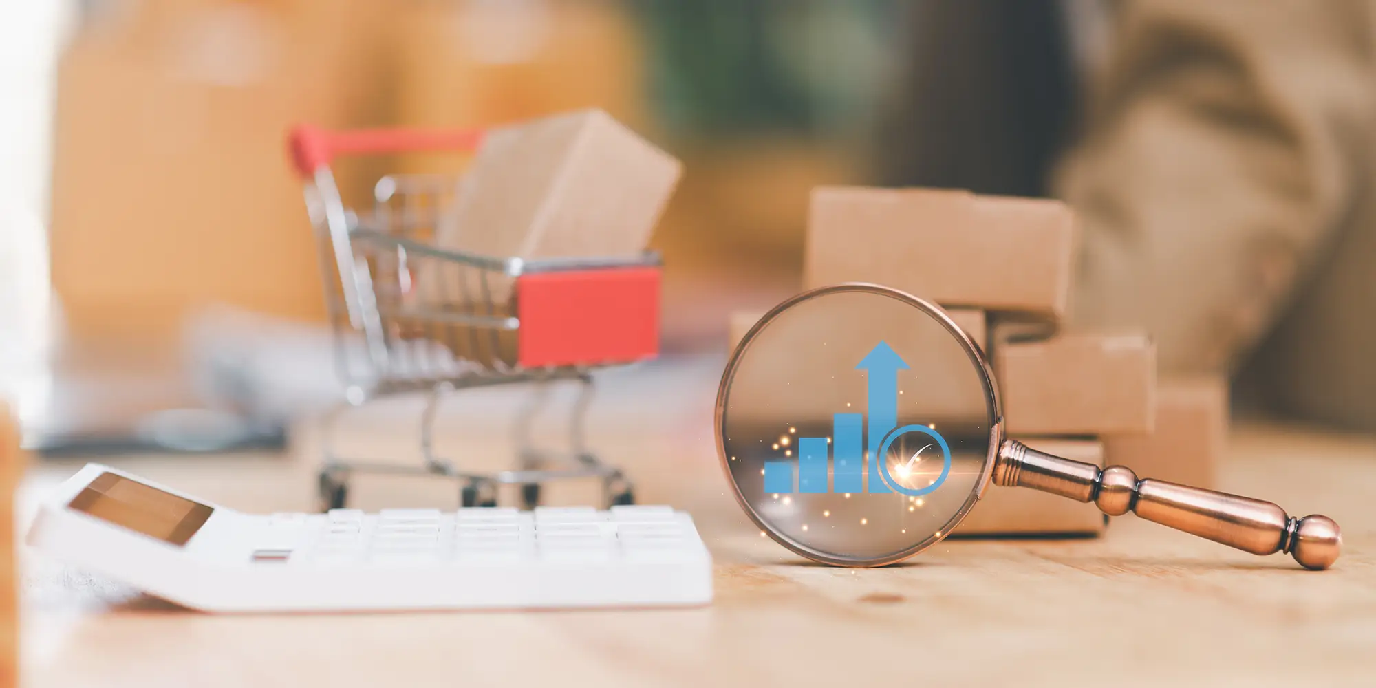 Calculator, magnifying glass, & mini shopping cart to signify offline tracking for marketing