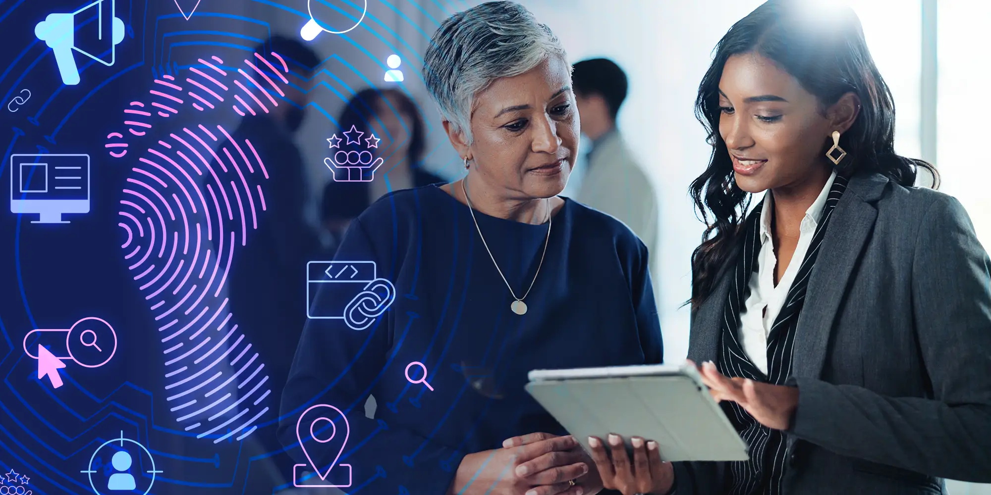 Two women looking at a tablet
