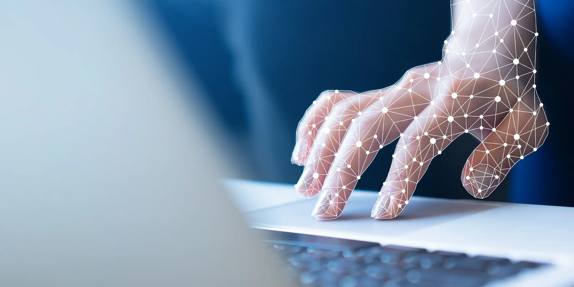 Hand on a laptop computer