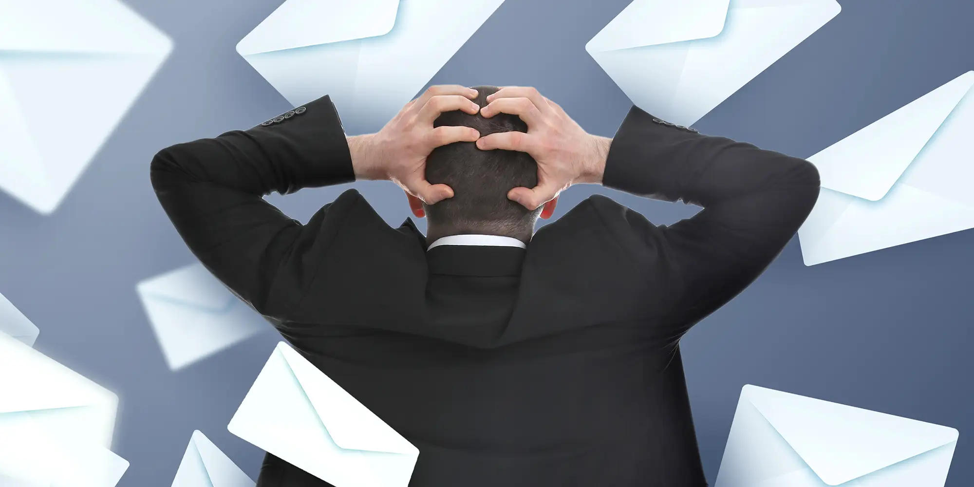 Exasperate man surrounded by flying envelopes