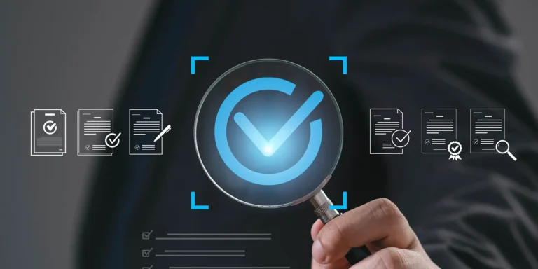 person holding a magnifying glass with a checkmark to represent standard operating procedures for small businesses